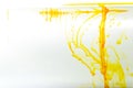 Yellow ink swirling in water, Color drop in water photographed in motion Royalty Free Stock Photo