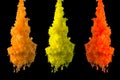 Yellow, orange paint clouds in water isolated on solid black background. Acrylic colors and ink in water. Abstract background. Bri Royalty Free Stock Photo
