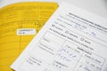 Yellow International Certificate of Vaccination book and German record card for SARS-CoV-2 Covid-19 immunization, concept for