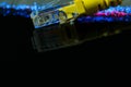 Yellow internet switch close up macro shot on shiny black surface Royalty Free Stock Photo