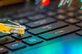 Yellow internet switch on gaming laptops RGB keyboard, glowing optical fibres