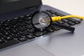 Yellow internet switch , magnifying glass close up macro shot on laptop computer Royalty Free Stock Photo