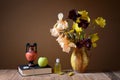 Yellow irises, amphorae, apple and book