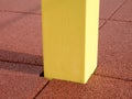 Yellow iron bar on workout playground. The beam holds