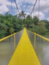 A yellow iron bridge over of a lake Royalty Free Stock Photo