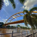 The yellow iron bridge stretches through the middle of Pekanbaru city