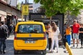 Yellow istanbul taxi in the middle of a street in istanbul, ready for a ride and a transfer in cab