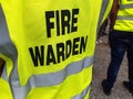 Yellow jacket showing fire warden on duty. Royalty Free Stock Photo