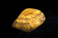 Yellow Jasper Stone against Black Background Royalty Free Stock Photo