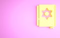 Yellow Jewish torah book icon isolated on pink background. Pentateuch of Moses. On the cover of the Bible is the image