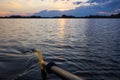 kayak paddle in a beautiful sunset on small Ploner lake with dramatic clouds, Plon, Ploen germany