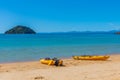 Yellow kayaks at Onetahuti beach at Abel Tasman national park in New Zealand