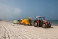 Yellow kayaks in tractor`s trailer on the beach of Caesarea, Israel