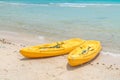 .Yellow kayaks on white sand beach Royalty Free Stock Photo