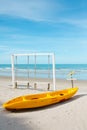 Yellow kayaks and white wooden swings on the beach Royalty Free Stock Photo