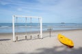 Yellow kayaks and white wooden swings on the beach Royalty Free Stock Photo