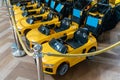 Yellow kid car cart made from plastic ready for pickup in mall Royalty Free Stock Photo