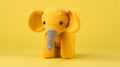 Yellow Knitted Elephant Toy On Bold Yellow Background