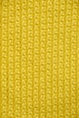 Yellow knitted fabric texture background. Top view. Copy, empty space for text