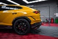 Yellow Lamborghini Urus Performante in indoor workshop service bay Royalty Free Stock Photo