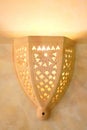 Yellow lamp in Arab style. Wall clay lamp in an arabic house in the middle East. Patterns on the wall lantern Royalty Free Stock Photo