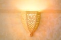 Yellow lantern in Arabic style. A clay lamp in an African house in the middle East. Patterns on the wall lamp yellow Royalty Free Stock Photo