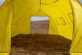 Yellow large basecamp tent on colorful mountains background