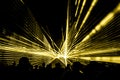 Yellow laser show nightlife club stage with party people crowd Royalty Free Stock Photo