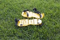 Yellow lawn aerator sandals with nails for lawn cultivation. Royalty Free Stock Photo