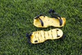 Yellow lawn aerator sandals with nails for lawn cultivation. Royalty Free Stock Photo