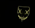 Yellow LED Halloween mask with black background Royalty Free Stock Photo