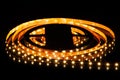 Yellow LED strip on reel with black background Royalty Free Stock Photo