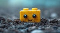 A yellow lego brick with a face sitting in the dirt, AI