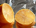 Yellow lemon on bright tinfoil background surface Royalty Free Stock Photo