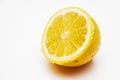 Yellow lemon half in sugar on a white background