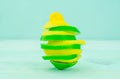 Yellow lemon and lime with fresh green mint on mint colour background