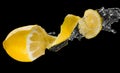 Yellow lemon splash macro isolated over black