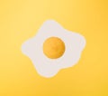 Yellow lemon on white and yellow paper. Minimal scrambled eggs design