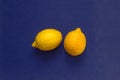 Yellow lemons on blue fabric