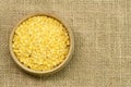 Yellow Lentils, wooden cup Royalty Free Stock Photo