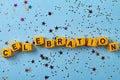 Yellow letter cubes arranged in celebraion word flat lay. Royalty Free Stock Photo