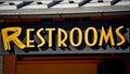 Yellow Lettered Restrooms Sign - Bathroom