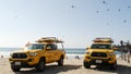 Yellow lifeguard car, beach near Los Angeles. Rescue Toyota pick up truck, lifesavers California USA