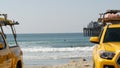 Yellow lifeguard car, beach near Los Angeles. Rescue Toyota pick up truck, lifesavers California USA