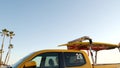 Yellow lifeguard car, ocean beach California USA. Rescue pick up truck, lifesavers vehicle.