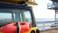 Yellow lifeguard car, ocean beach California USA. Rescue pick up truck, lifesavers vehicle.