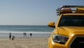 Yellow lifeguard car, ocean beach California USA. Rescue pick up truck, lifesavers vehicle. Royalty Free Stock Photo