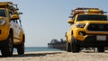 Yellow lifeguard car, ocean beach California USA. Rescue pick up truck, lifesavers vehicle. Royalty Free Stock Photo