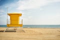 Yellow lifeguard post on an empty beach