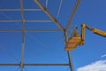 Yellow lifting platform for construction in the construction of Royalty Free Stock Photo